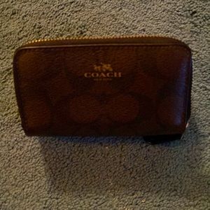 Coin-credit card wallet brown and black with gold Coach details.